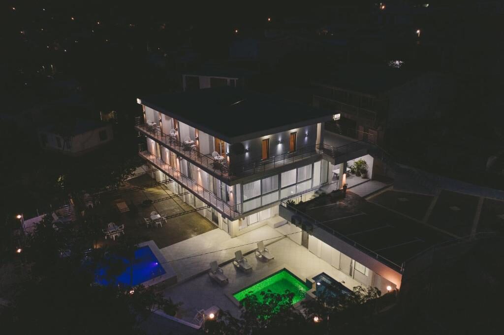 Vila Nikezić at night with lit pools and terraces